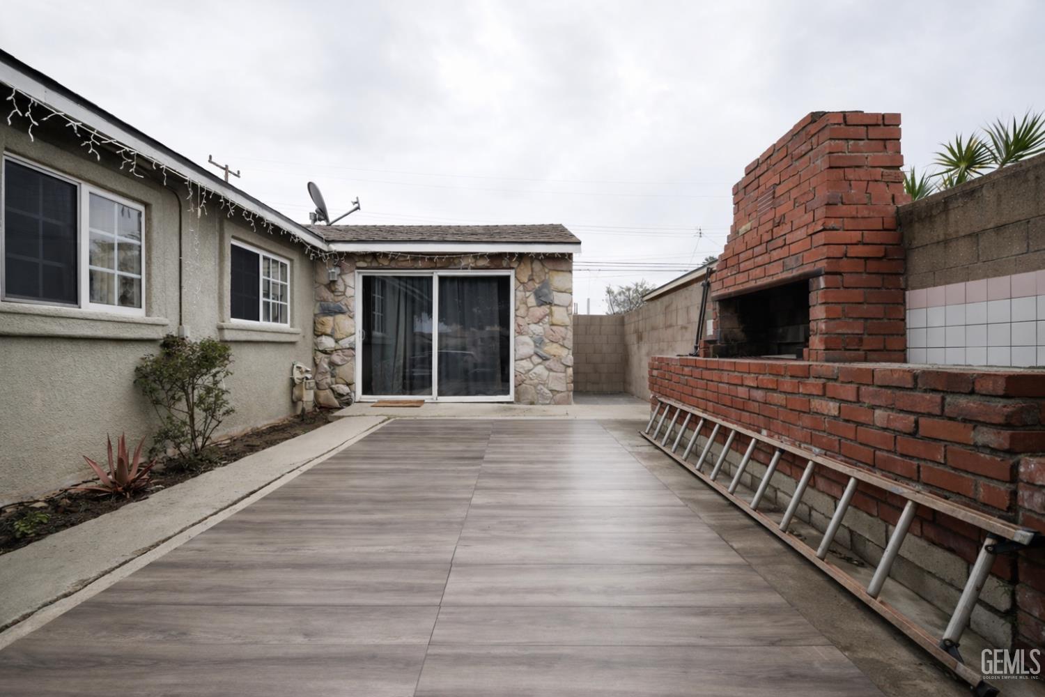 Undisclosed Address Oxnard, CA 93033 - Photo 12 of 14 a view of a house with a wooden deck