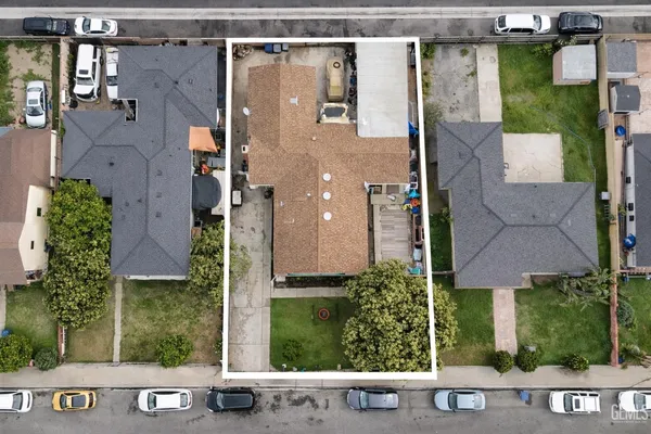 a aerial view of a house with a yard and plants