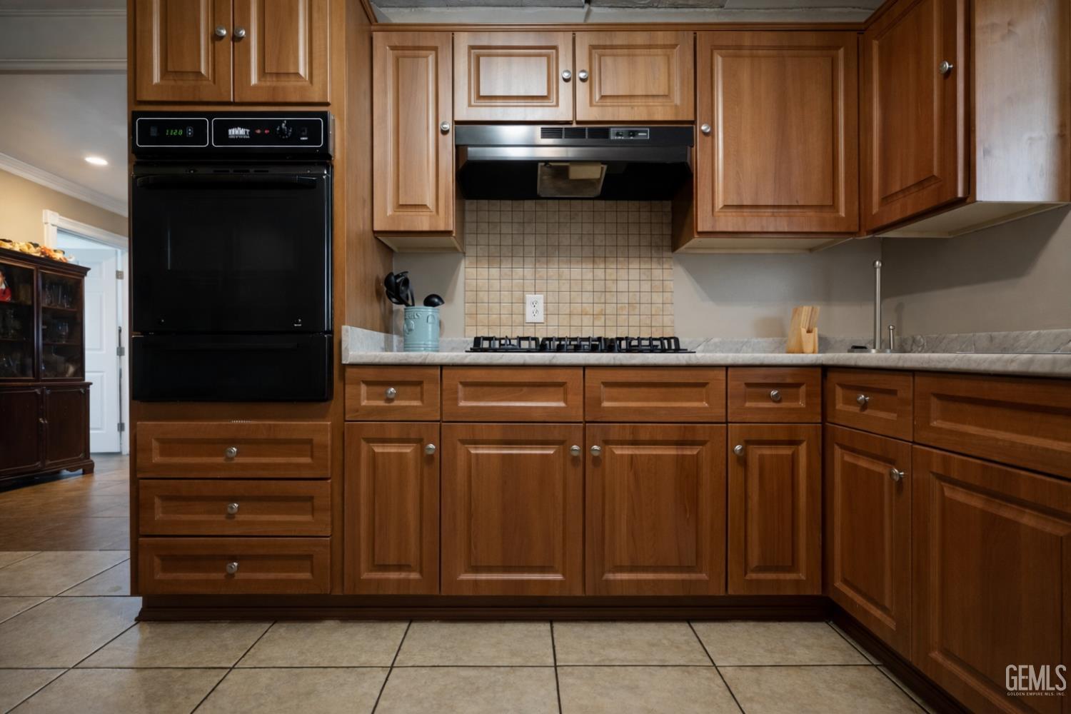 Undisclosed Address Oxnard, CA 93033 - Photo 8 of 14 a kitchen with a refrigerator and cabinets