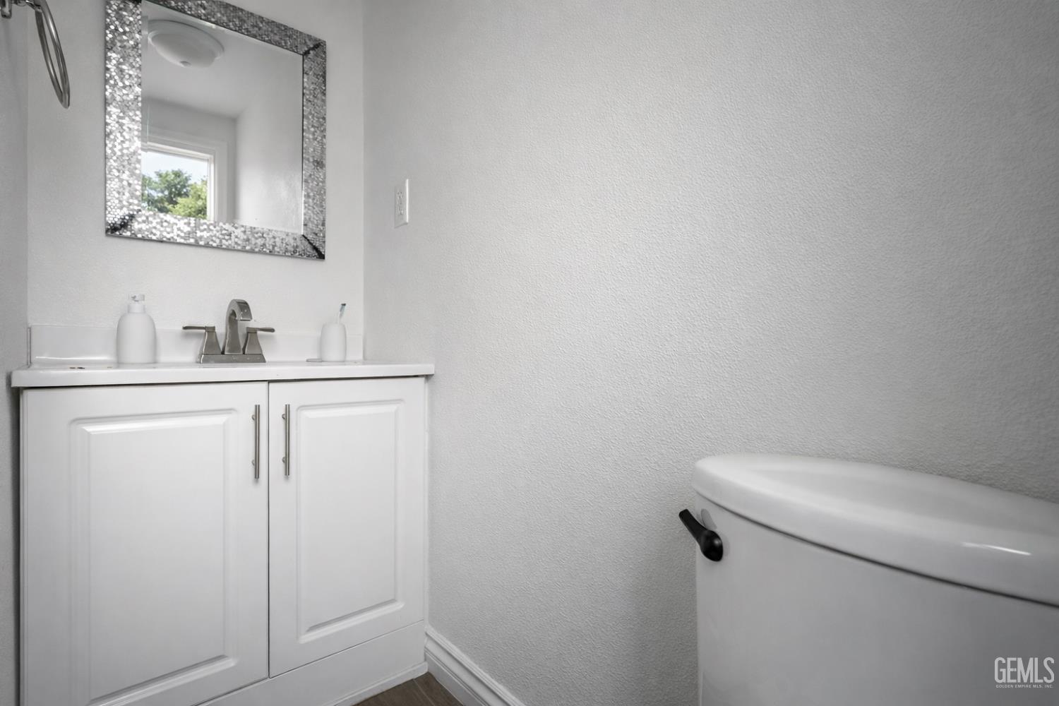 Undisclosed Address Oxnard, CA 93033 - Photo 9 of 14 a bathroom with a toilet sink and mirror