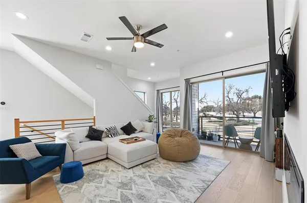 a living room with furniture fireplace and a flat screen tv
