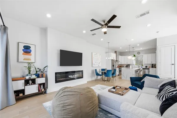 a bathroom with a sink a toilet and shower curtain