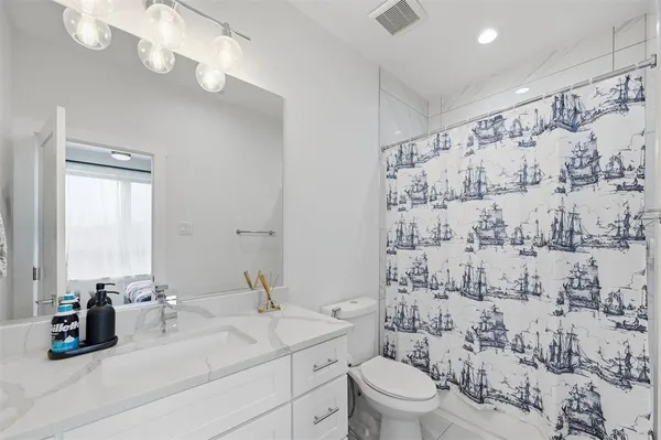a kitchen with sink cabinets and wooden floor