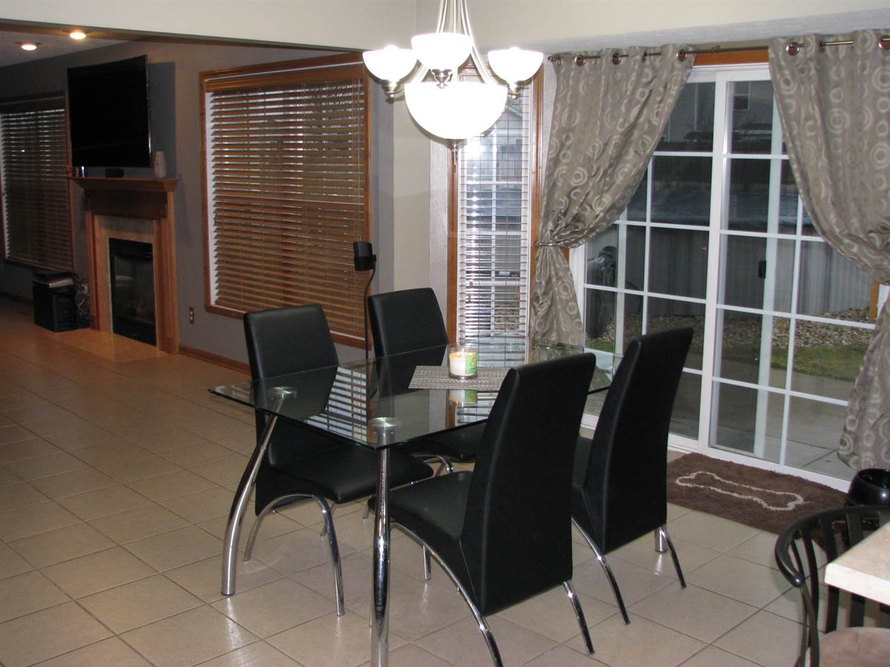 11044 Chicory Ridge Way Roscoe, IL 61073 - Photo 4 of 20 a view of a dining room with furniture and chandelier