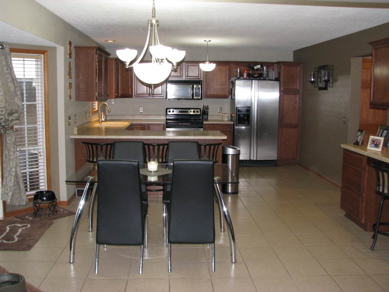 11044 Chicory Ridge Way Roscoe, IL 61073 - Photo 6 of 20 a kitchen with a table and chairs in it