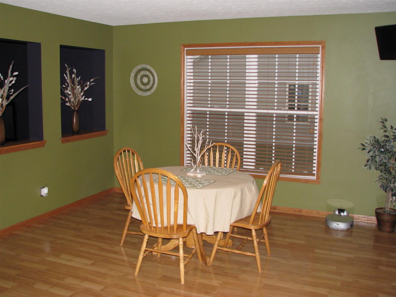 11044 Chicory Ridge Way Roscoe, IL 61073 - Photo 8 of 20 a view of a dining room with furniture and wooden floor