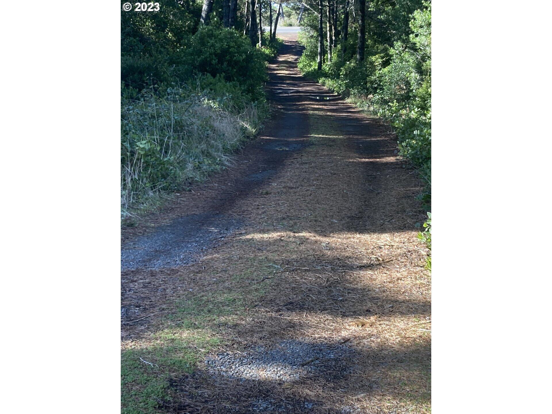 88265 Rhododendron Drive Florence, OR 97439 - Photo 2 of 9 Looking back at entry. Great opportunity for buffered lot privacy.