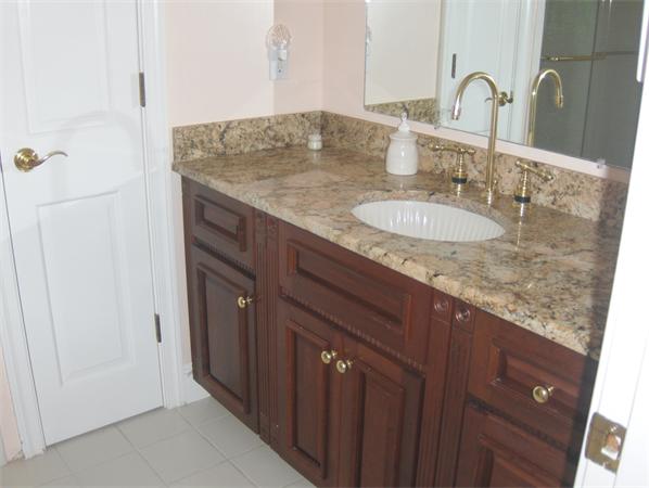 47 Stonecleave Road Boxford, MA 01921 - Photo 9 of 26 a bathroom with a granite countertop sink and a mirror
