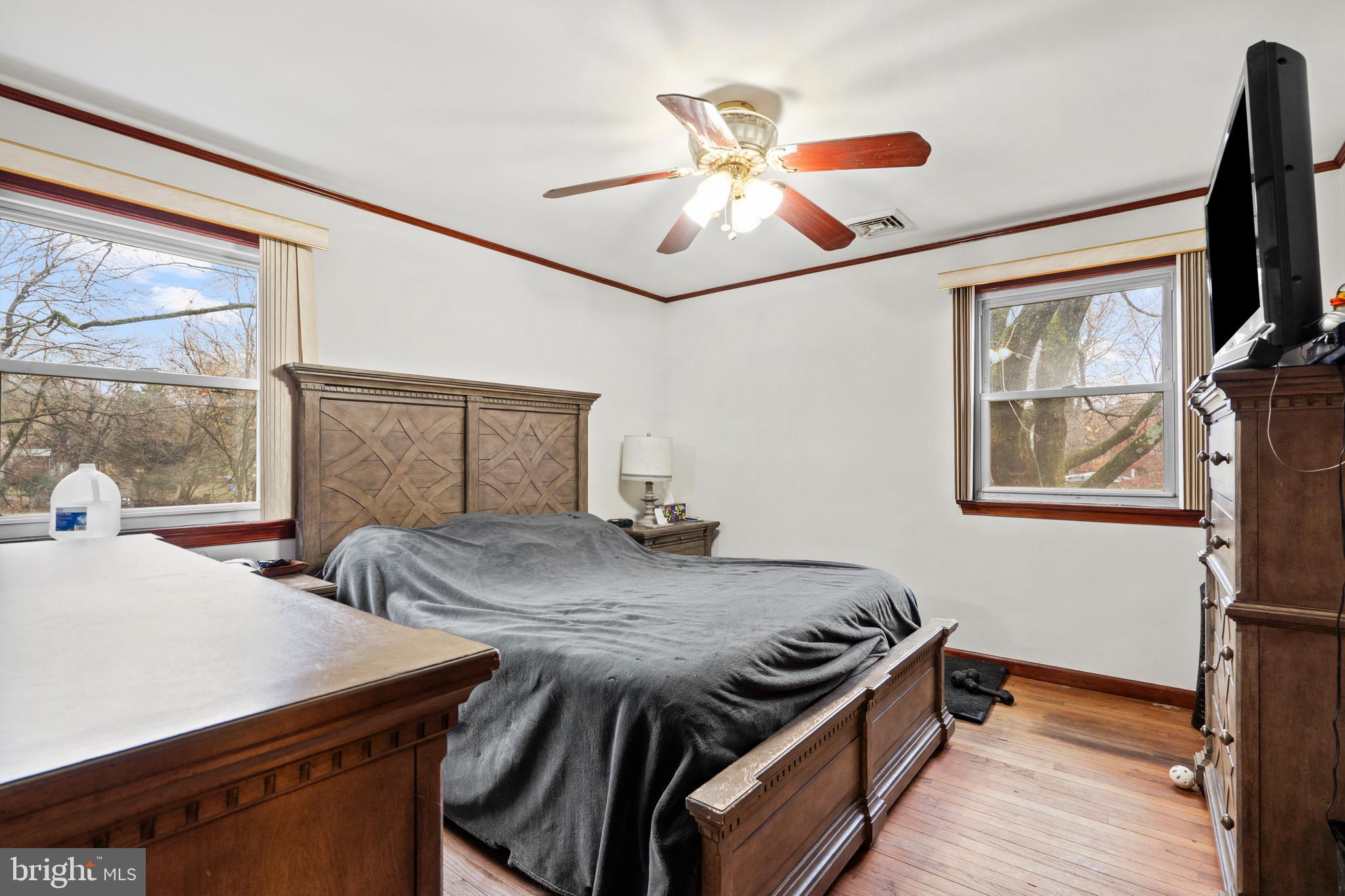 1538 Temple Road Pottstown, PA 19465 - Photo 11 of 29 a bedroom with a bed and a chandelier