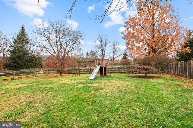 a view of backyard with swimming pool