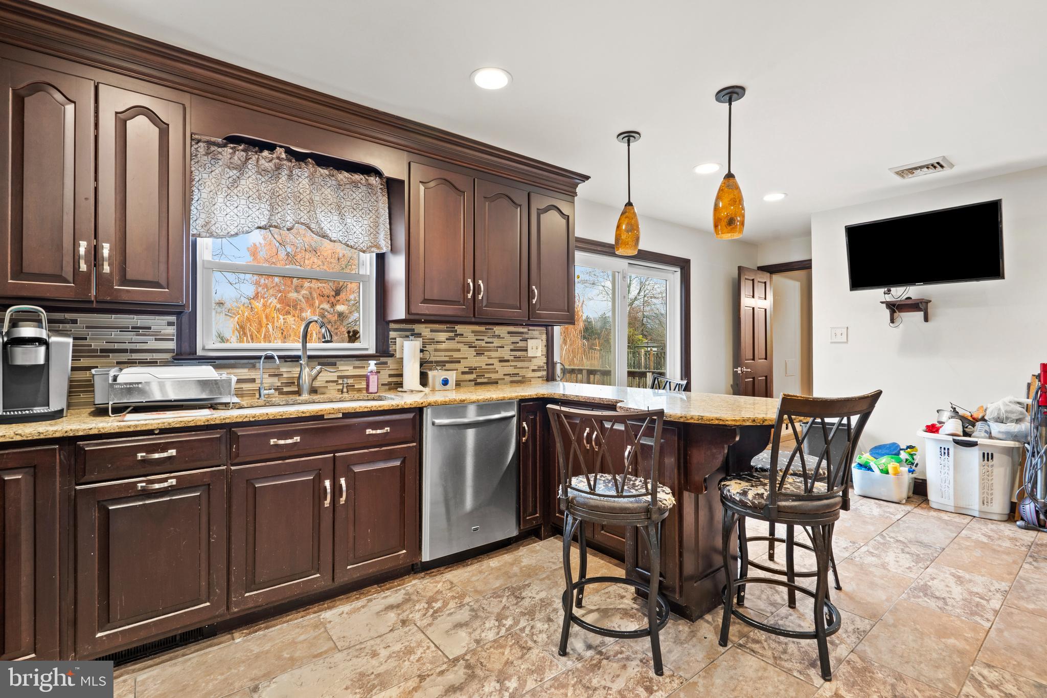 1538 Temple Road Pottstown, PA 19465 - Photo 8 of 29 a kitchen with stainless steel appliances granite countertop a sink table and chairs