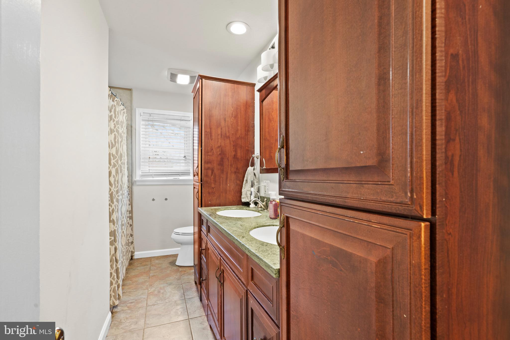 1538 Temple Road Pottstown, PA 19465 - Photo 10 of 29 a bathroom with a sink a mirror and a bathtub