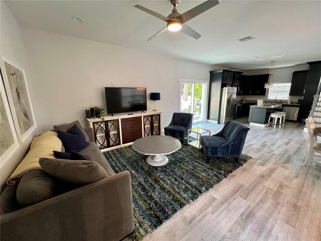 5630 Queener Avenue Port Richey, FL 34668 - Photo 12 of 37 a living room with furniture and a flat screen tv