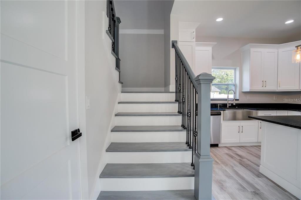5630 Queener Avenue Port Richey, FL 34668 - Photo 20 of 37 a view of entryway and hall with wooden floor