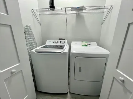 a utility room with dryer and washer