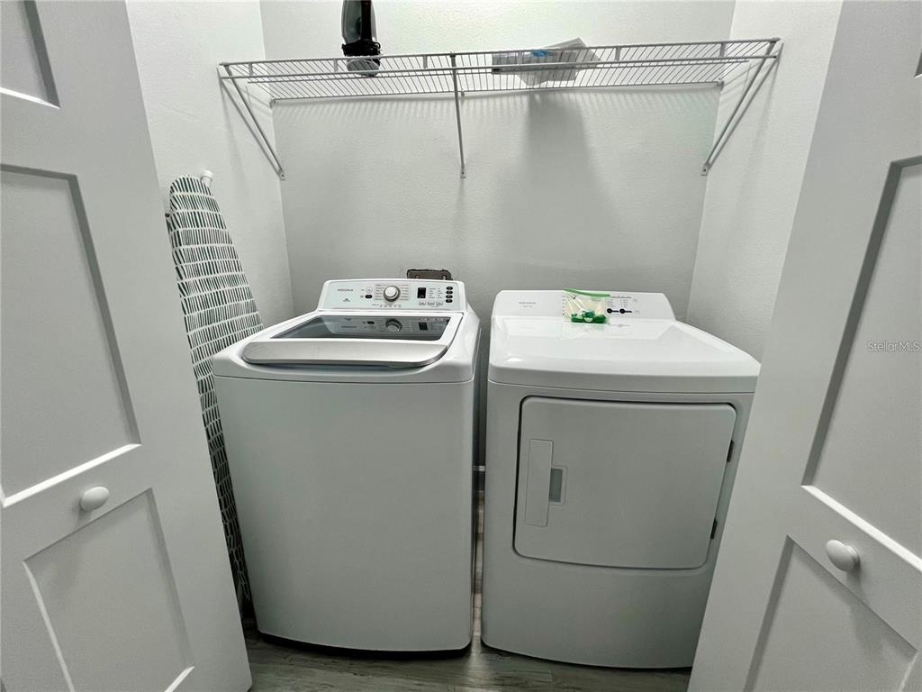 5630 Queener Avenue Port Richey, FL 34668 - Photo 33 of 37 a utility room with dryer and washer