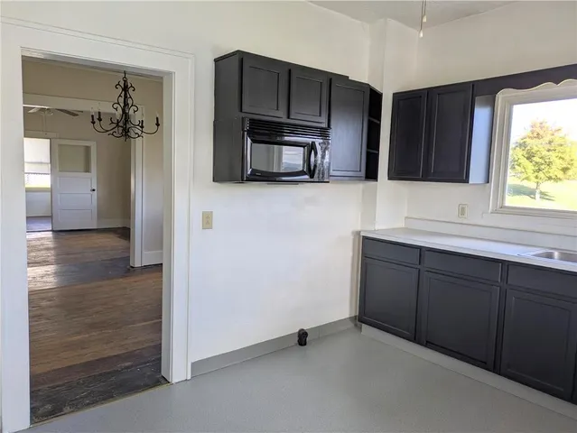 a view of a hallway view with wooden floor and staircase