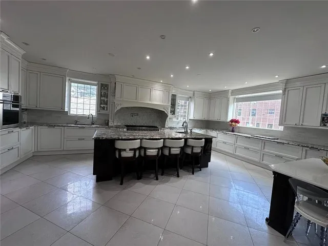 a kitchen with a sink a counter top space and appliances