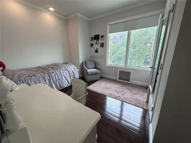 a bedroom with bed and window