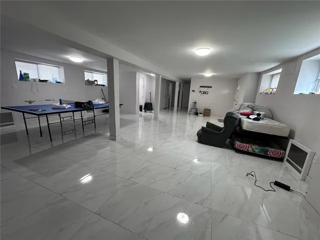 a lobby with furniture and wooden floor