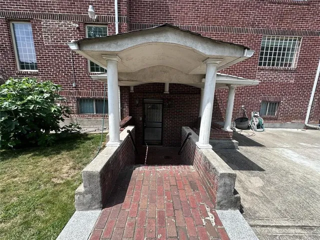 a view of a patio with couches table and chairs with potted plants
