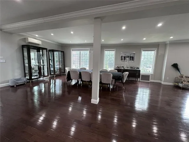 a lobby with furniture and floor to ceiling window