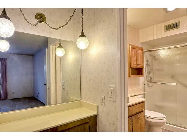 1714 Old Mill Road Encinitas, CA 92024 - Photo 11 of 22 DOWNSTAIRS MASTER BEDROOM HAS VANITY COUNTER AND MIRROR IN THE BEDROOM.