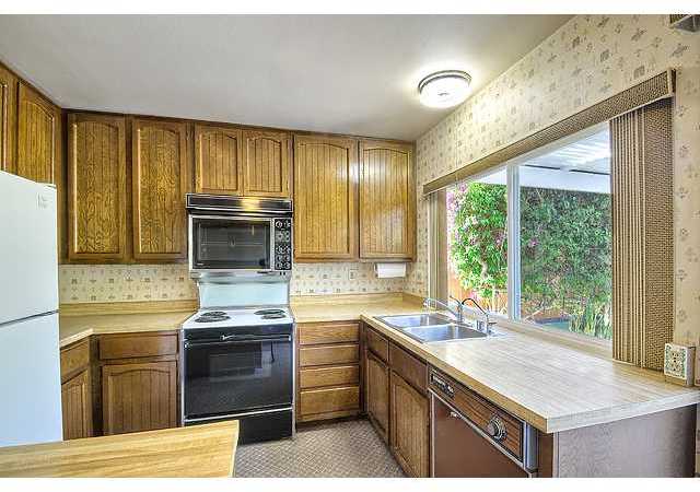 1714 Old Mill Road Encinitas, CA 92024 - Photo 13 of 22 PLENTY OF CABINET SPACE AND BIG WINDOW WITH VIEW OF THE BACK YARD.