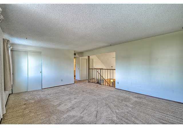 1714 Old Mill Road Encinitas, CA 92024 - Photo 18 of 22 VIEW ACROSS HUGE FAMILY ROOM TO STAIRS. 2 ADDITIONAL BEDROOMS DOWN THE HALL.