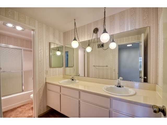 1714 Old Mill Road Encinitas, CA 92024 - Photo 20 of 22 UPSTAIRS BATHROOM WITH 2 SINKS AND PRIVACY FOR TOILET AND TUB.