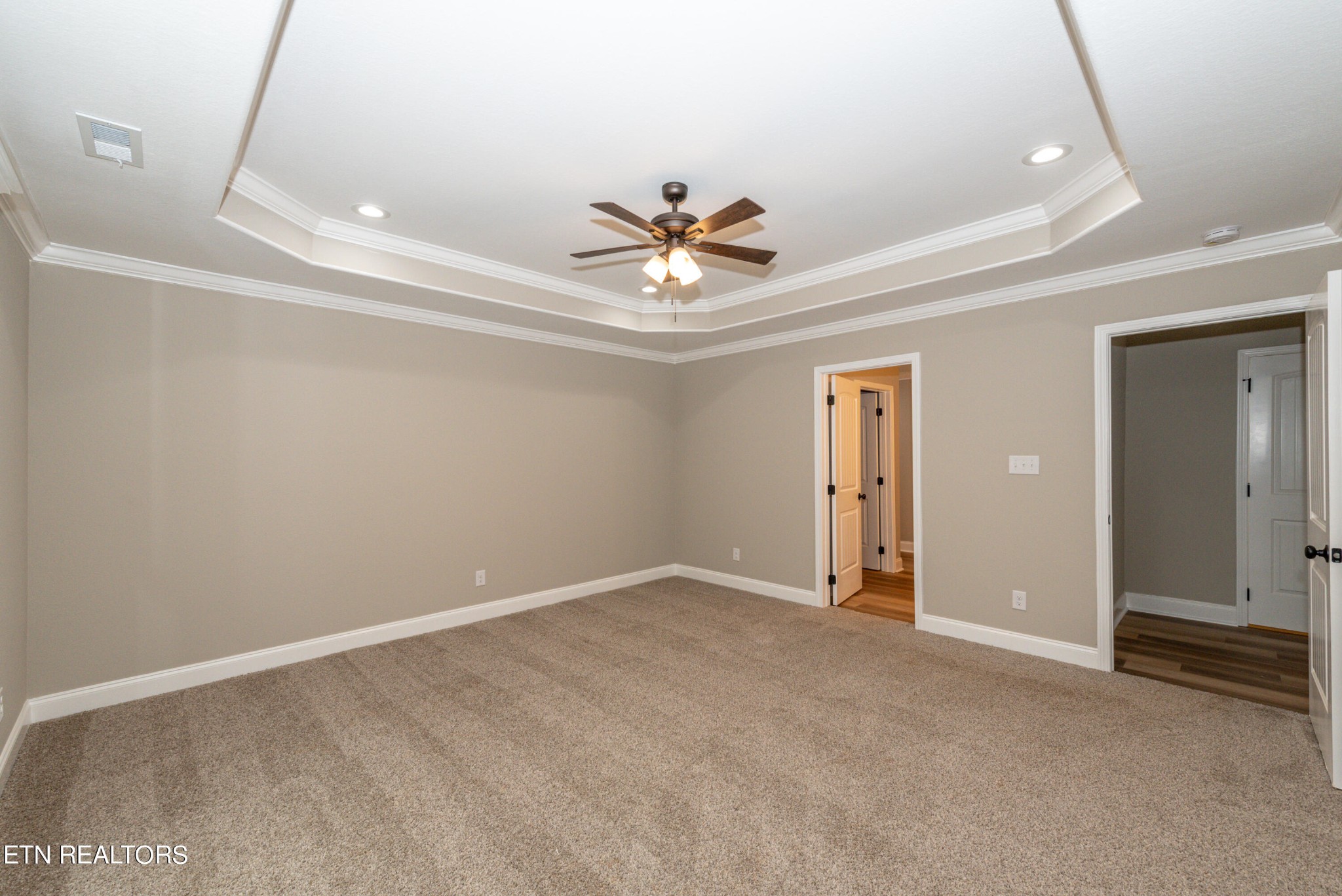 3650 Big Springs Road Friendsville, TN 37737 - Photo 18 of 26 an empty room that has a ceiling fan and a window