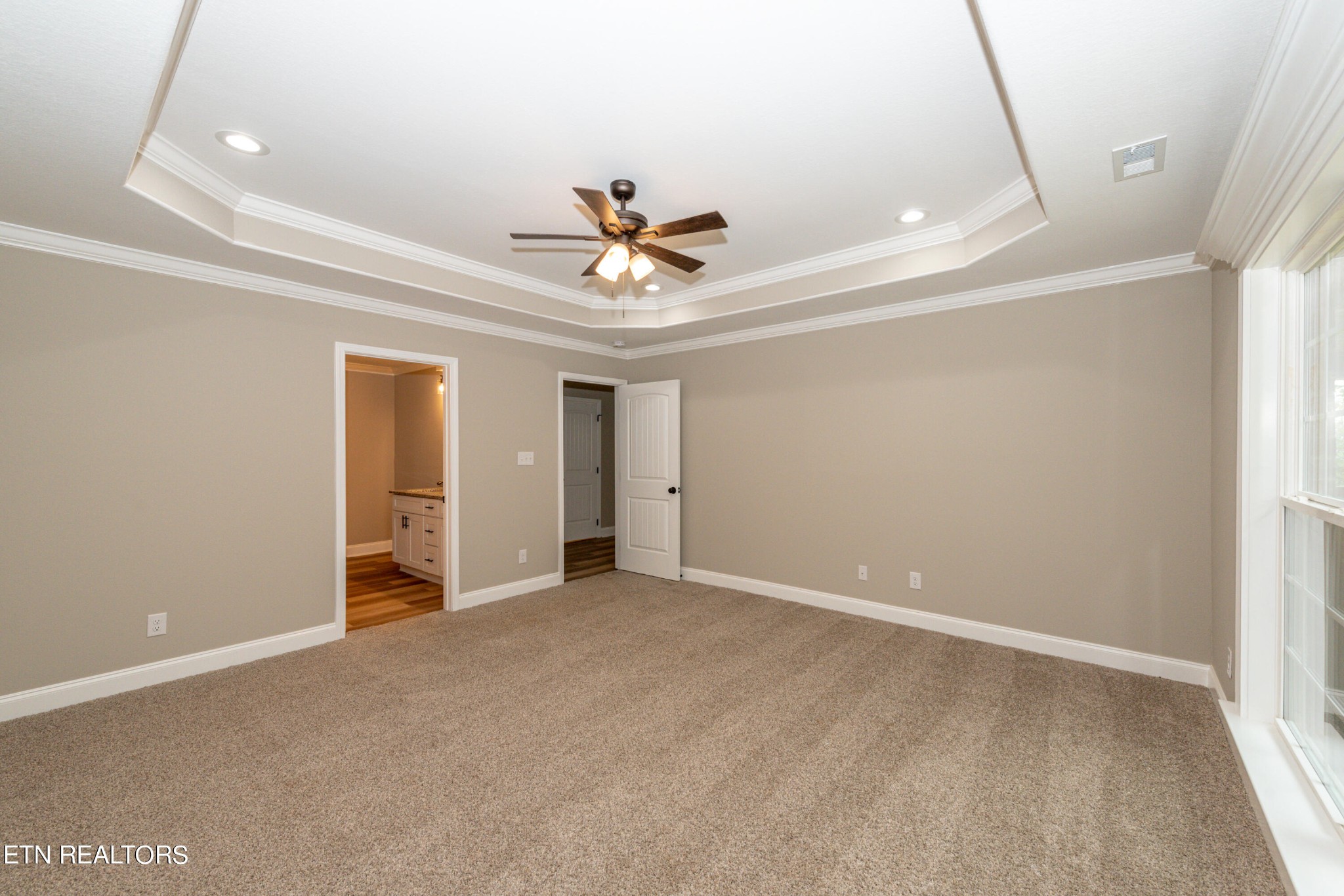 3650 Big Springs Road Friendsville, TN 37737 - Photo 19 of 26 a view of an empty room with a ceiling fan