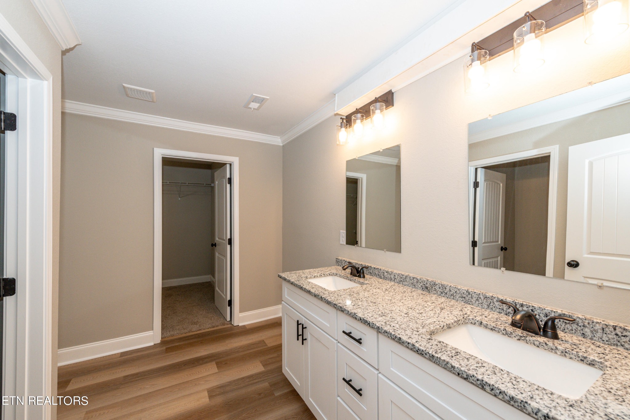 3650 Big Springs Road Friendsville, TN 37737 - Photo 20 of 26 a bathroom with a granite countertop sink and a mirror