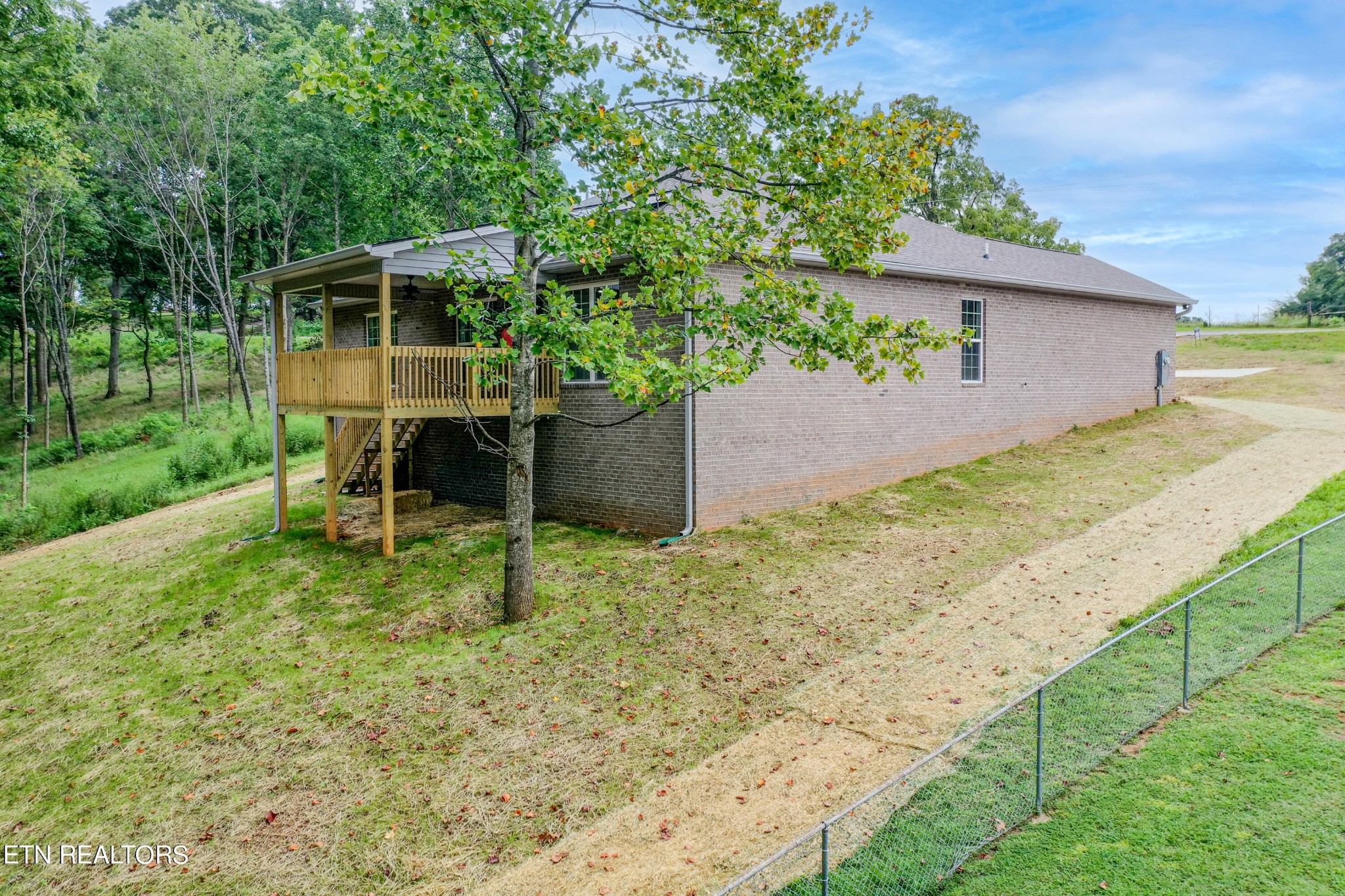 3650 Big Springs Road Friendsville, TN 37737 - Photo 8 of 26 a backyard of a house with plants and garden