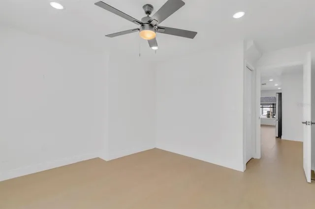 a view of a room with a ceiling fan