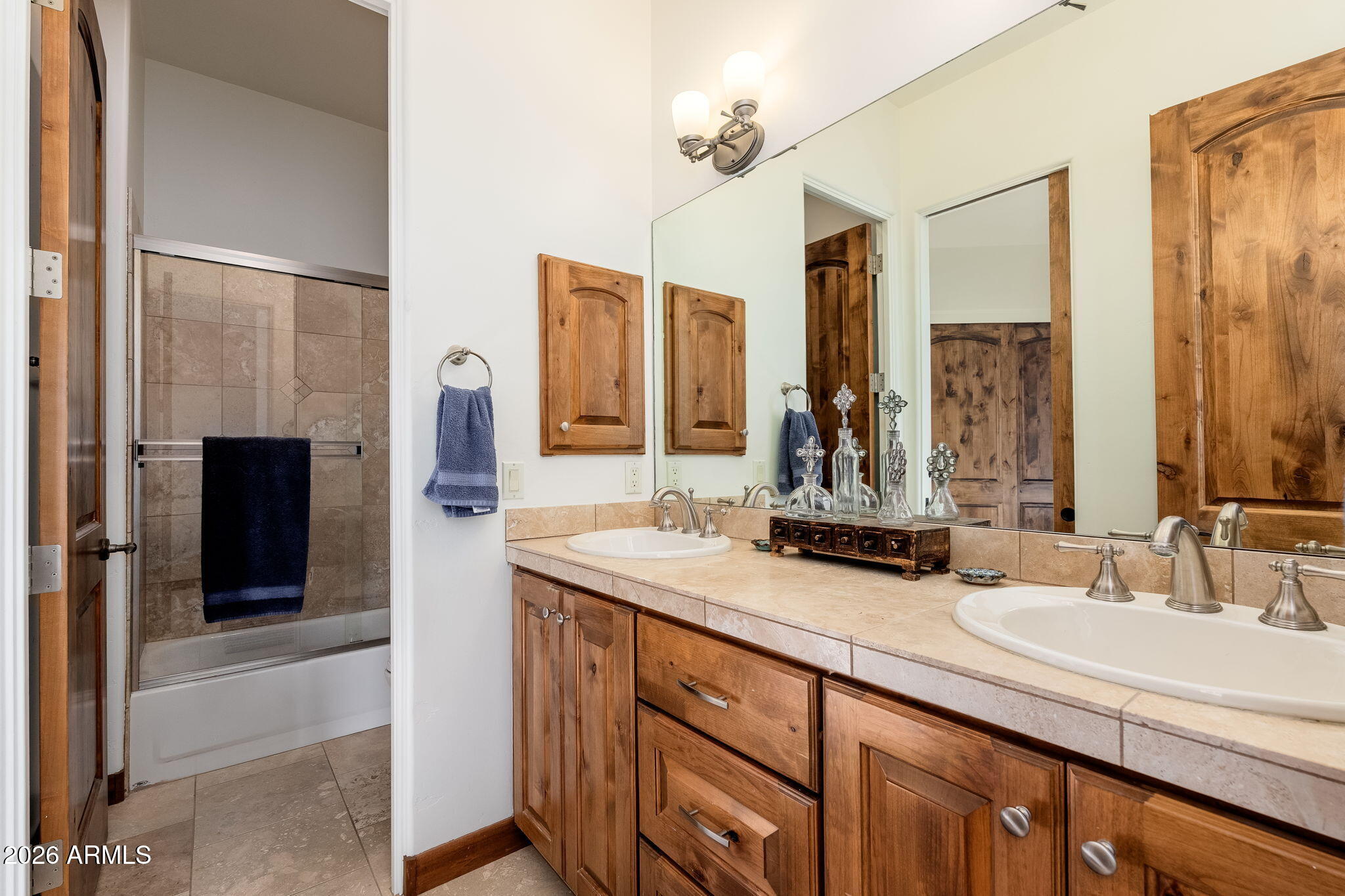 2208 East Filaree Circle Payson, AZ 85541 - Photo 25 of 60 a bathroom with a double vanity sink a mirror and a shower