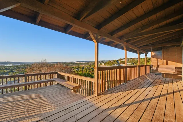 a view of balcony with wooden floor