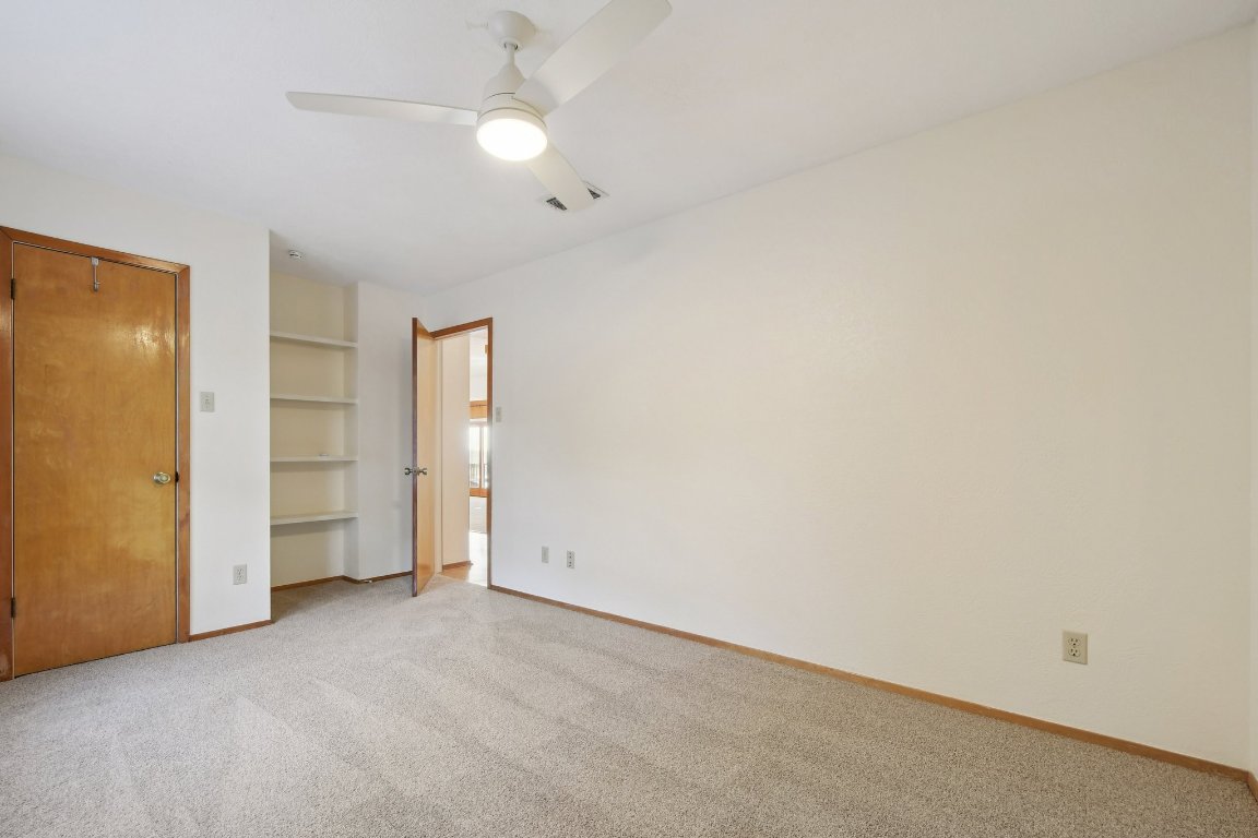 21009 Fawn Ridge Drive Lago Vista, TX 78645 - Photo 23 of 40 an empty room with closet and windows