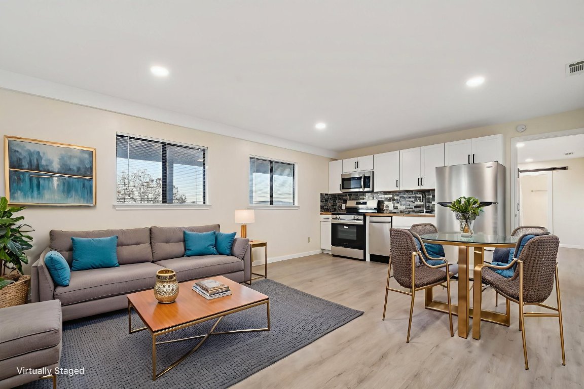 21009 Fawn Ridge Drive Lago Vista, TX 78645 - Photo 28 of 40 a living room with furniture and kitchen view