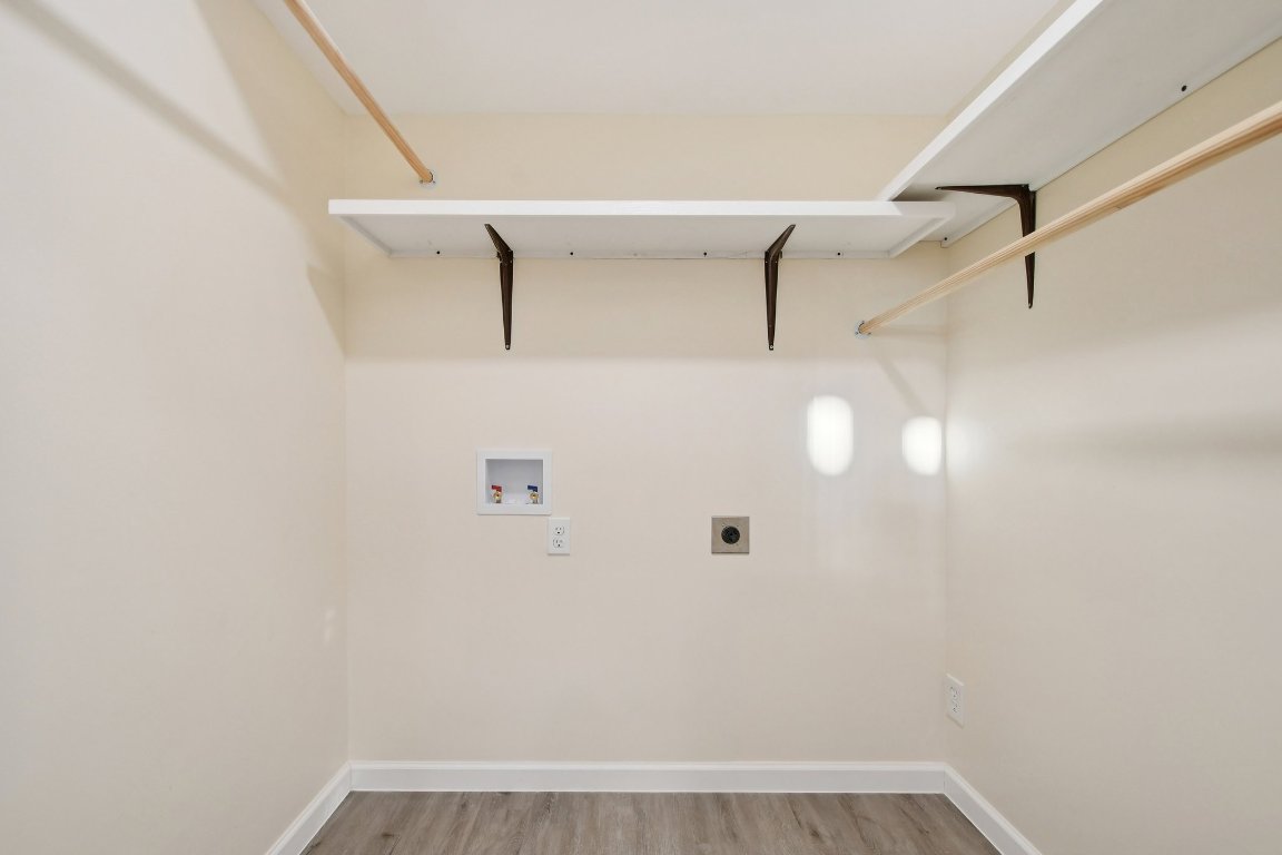 21009 Fawn Ridge Drive Lago Vista, TX 78645 - Photo 35 of 40 Washroom with light wood finished floors, electric dryer hookup, and hookup for a washing machine