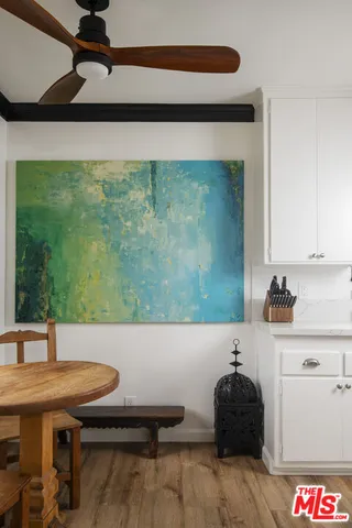 a living room with a table and chairs