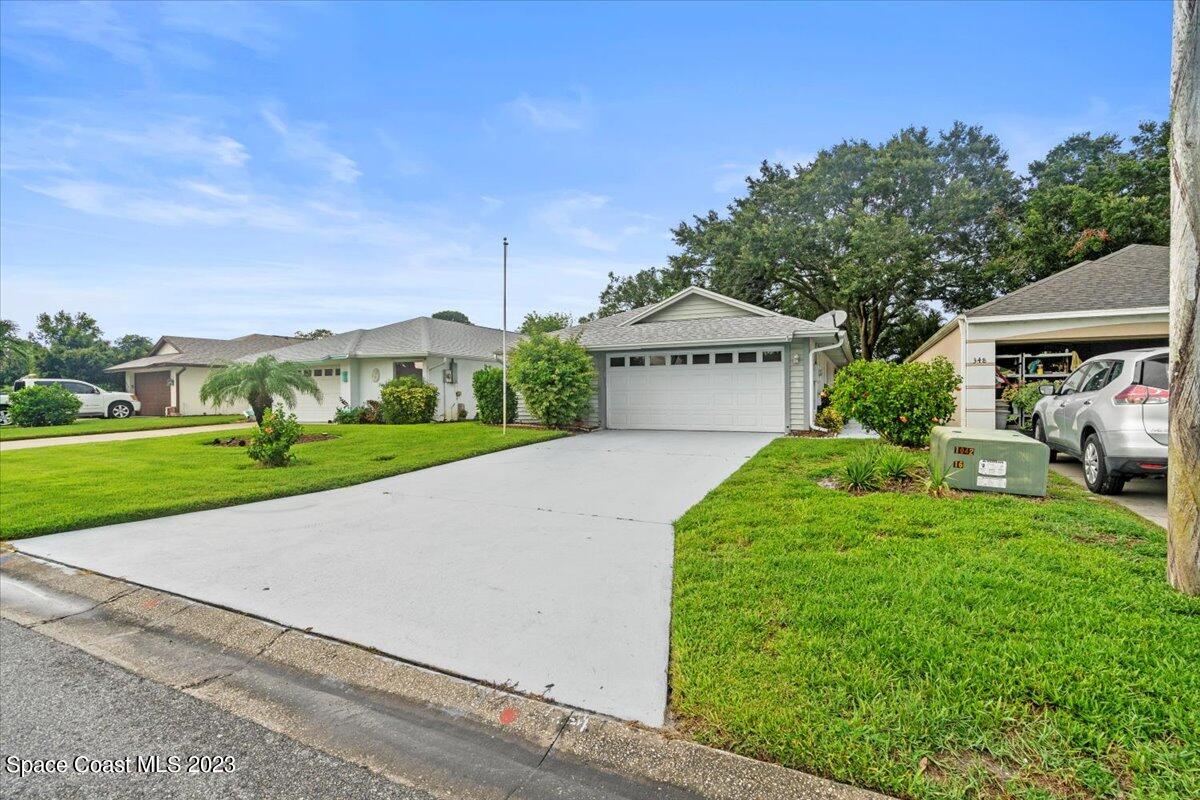 350 Myrtlewood Road Melbourne, FL 32940 - Photo 4 of 46 a house with green field in front of it
