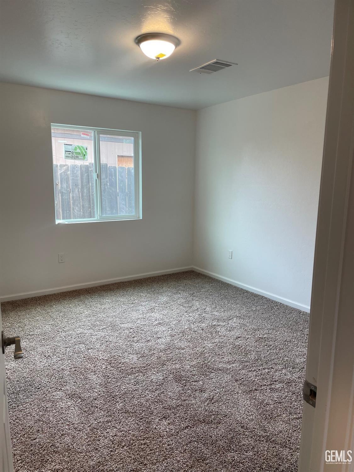 Undisclosed Address Bakersfield, CA 93308 - Photo 11 of 17 an empty room with a window