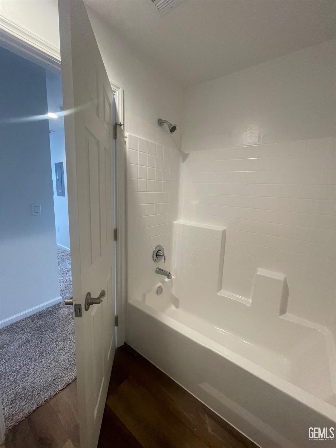 Undisclosed Address Bakersfield, CA 93308 - Photo 14 of 17 a bathroom with a bathtub and a shower
