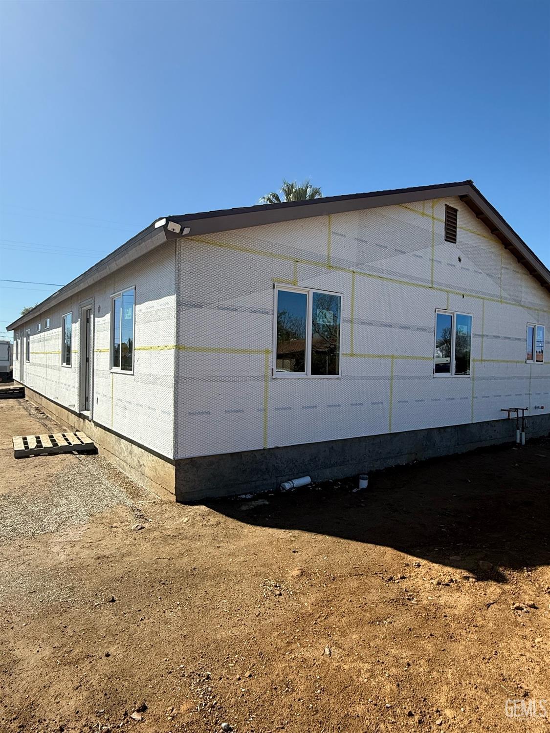 Undisclosed Address Bakersfield, CA 93308 - Photo 3 of 17 a view of a house with a snow in the yard