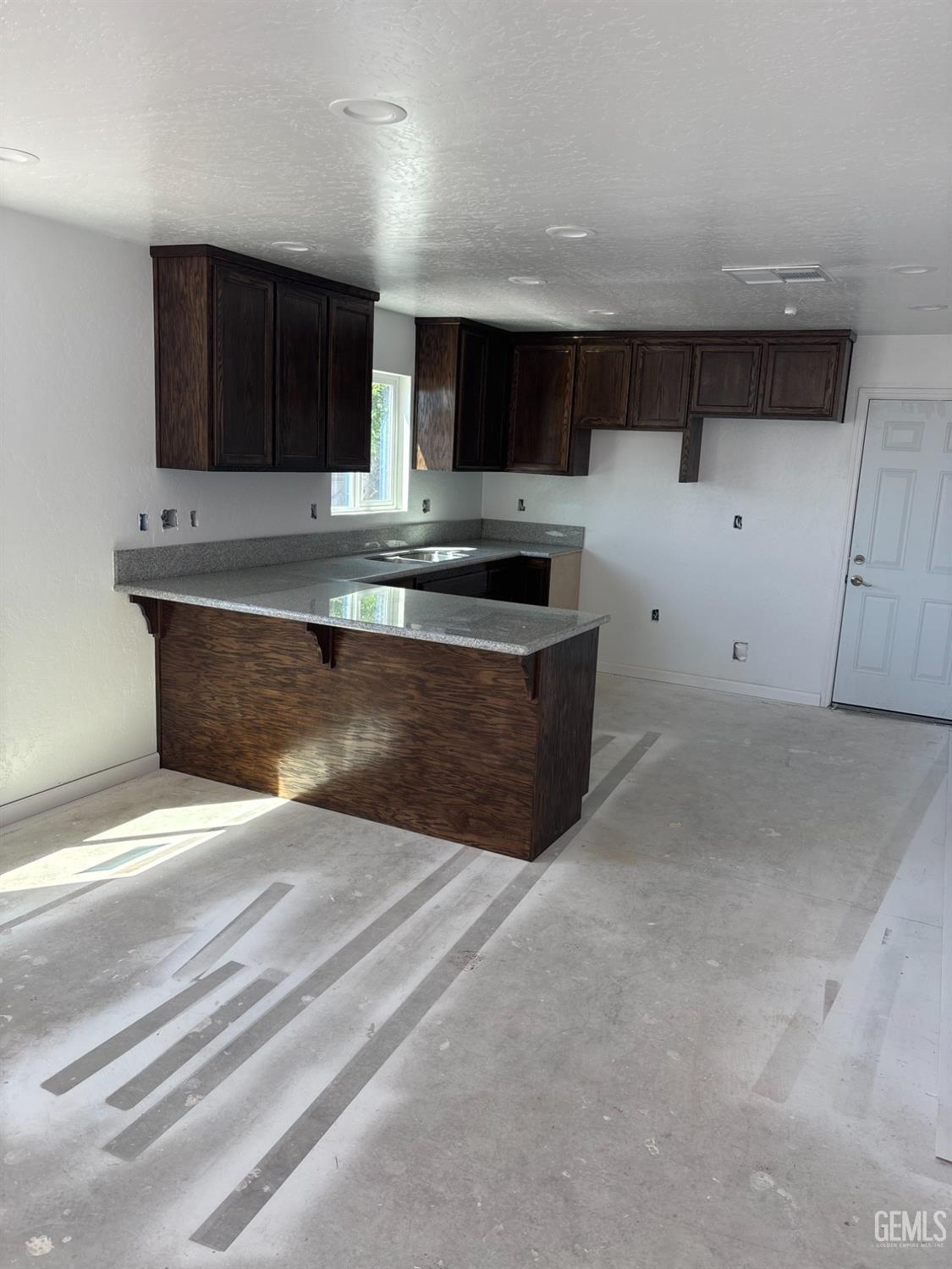 Undisclosed Address Bakersfield, CA 93308 - Photo 8 of 17 a view of kitchen with stainless steel appliances granite countertop a sink and a stove