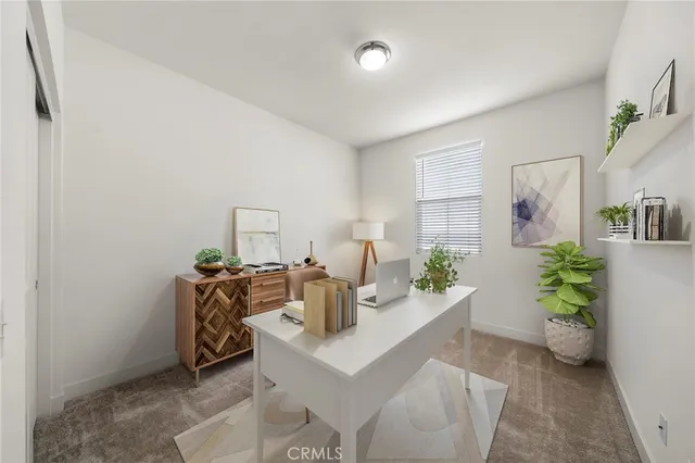 a living room with furniture and flowers