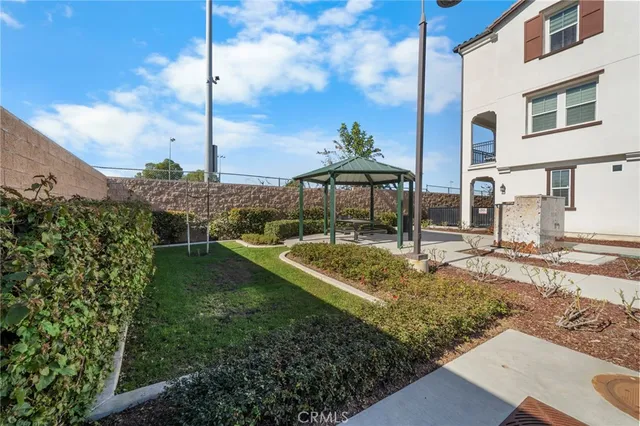 a couple of cars parked in front of a building