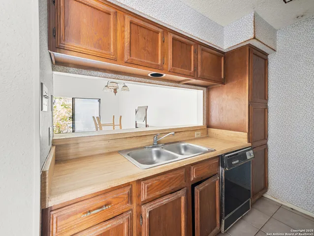 a kitchen with a stove and a microwave