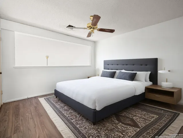 a view of a room with wooden floor and cabinet